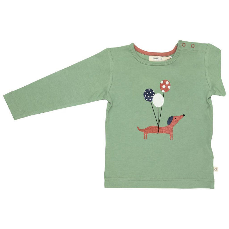 Green long-sleeve shirt with a dog and balloons design on a white background