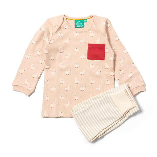 Children's outfit with pink long-sleeve shirt and white pants on a white background