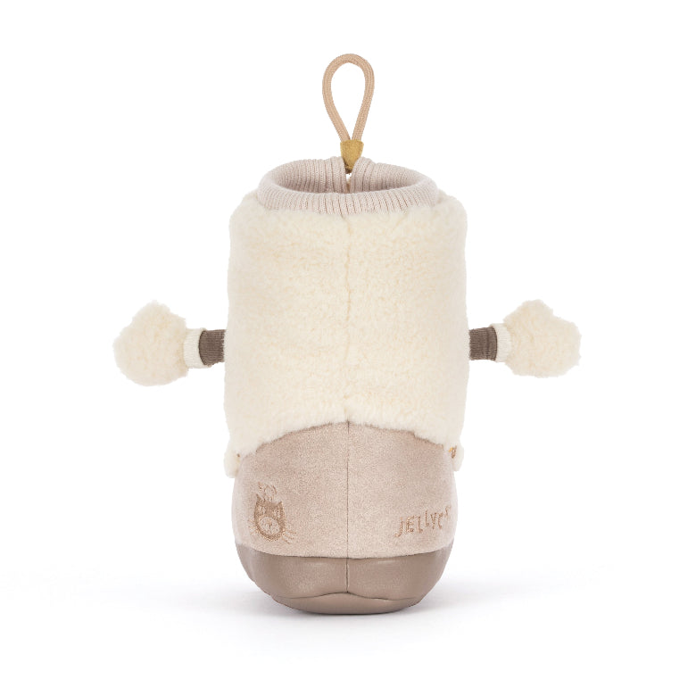 A Jelsyte plush bootie toy designed to look like a baby bootie, featuring a cream sherpa upper, a beige fabric lower section, and a tan hanging loop at the top, set against a plain white background.
