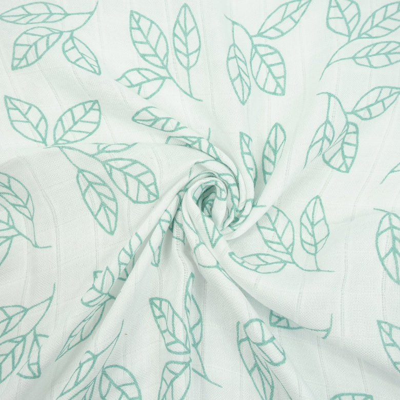 Fabric with green leaf pattern on a white background