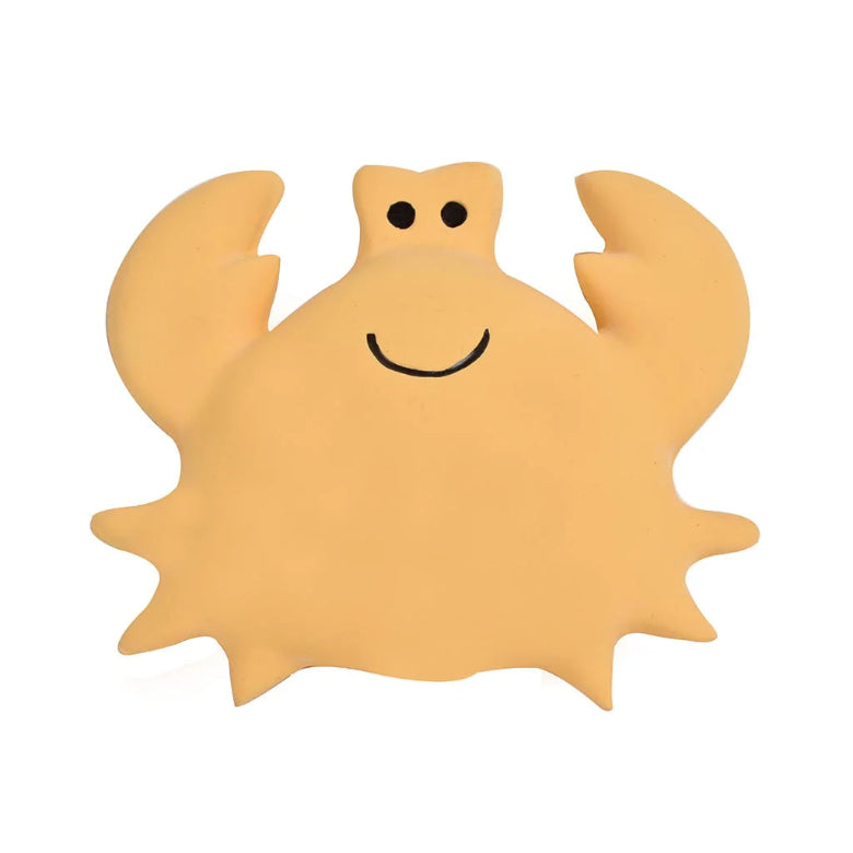 Yellow crab-shaped object with a smiley face on a white background