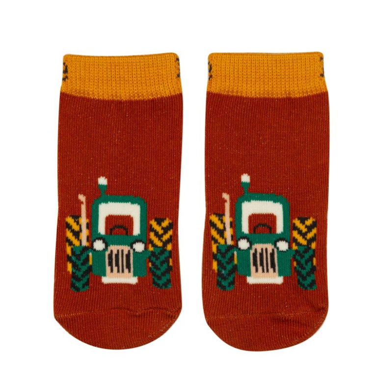 Pair of socks with tractor design on a white background