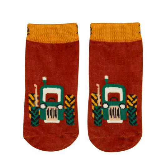 Pair of socks with tractor design on a white background