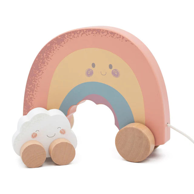Wooden toy with a rainbow and cloud design on a white background