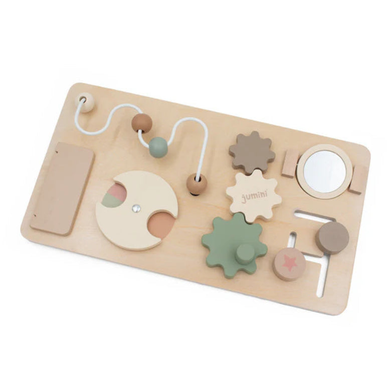 Wooden toy puzzle with various shapes and textures on a white background