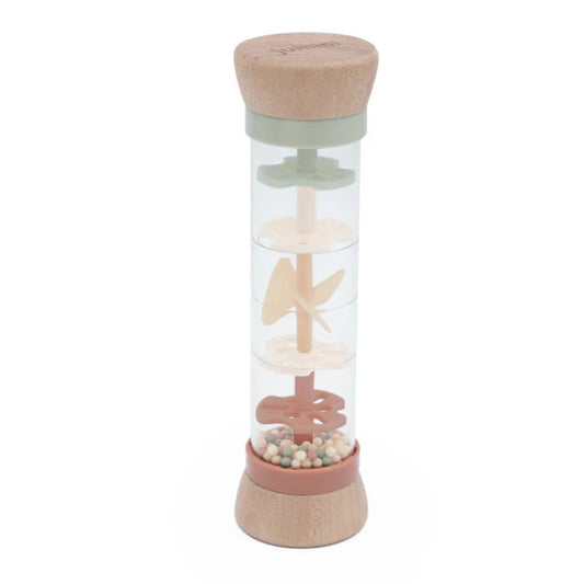 Transparent bottle with wooden and pink accents on a white background