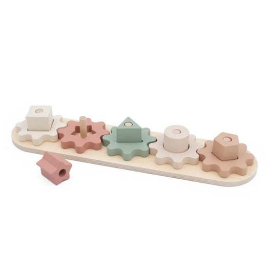Wooden shape sorting toy with pastel-colored shapes on a white background