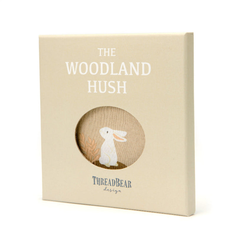Beige box with 'The Woodland Hush' and 'ThreadBear Design' text, featuring a rabbit illustration.