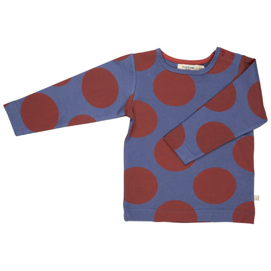 Blue sweater with red polka dots on a white background