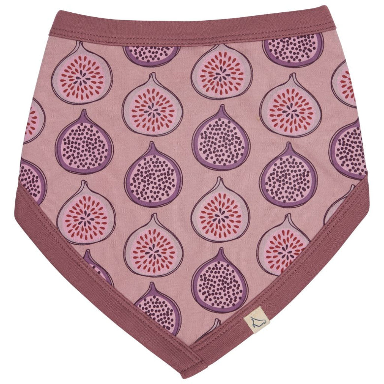 A triangular bandana bib with a dusty rose pink background, featuring an all-over print of stylized figs in purple and red. The bib has a solid dusty rose border and a small white brand tag near the bottom right corner.