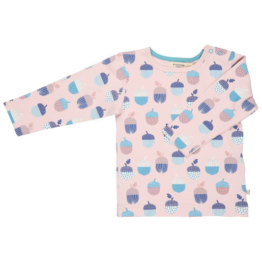 Pink long-sleeve shirt with acorn pattern on a white background