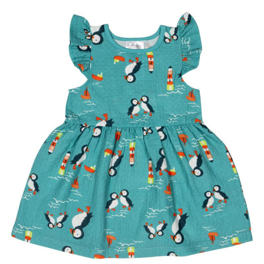Children's dress with penguin pattern on a white background