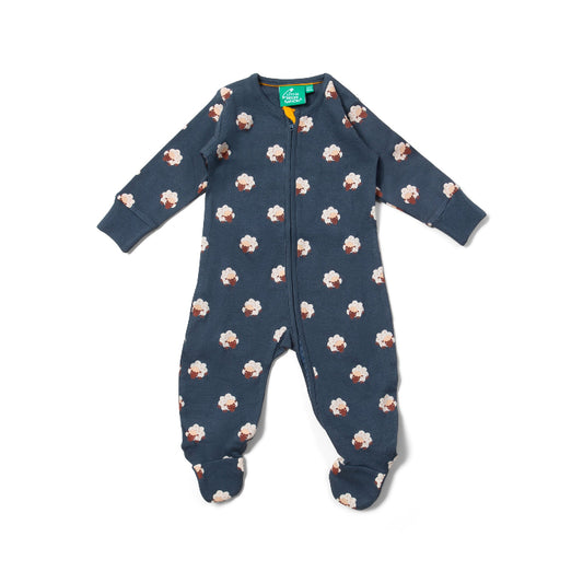 Blue baby onesie with cupcake pattern on a white background