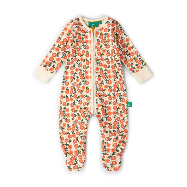 A baby long-sleeve footed sleeper with a cream background and an all-over orange floral print with green leaves. It features a front zipper and ribbed cuffs and footies.