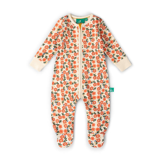 A baby long-sleeve footed sleeper with a cream background and an all-over orange floral print with green leaves. It features a front zipper and ribbed cuffs and footies.