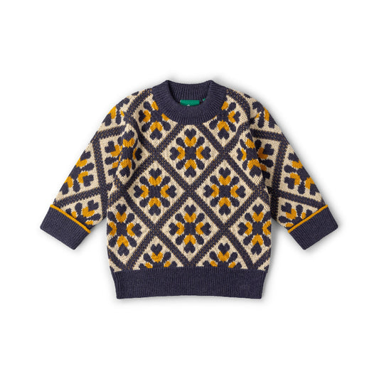 A long-sleeve knit sweater with a geometric diamond pattern in navy blue, cream, and mustard yellow, laid flat on a white background.