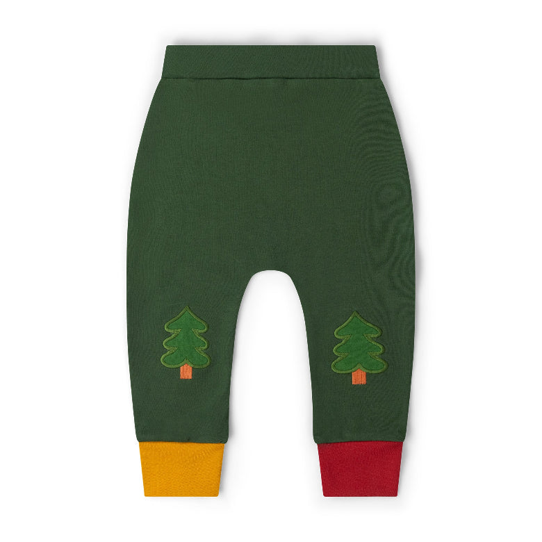 Dark green baby pants with embroidered pine tree motifs on the lower legs and contrasting yellow and red ribbed cuffs, shown flat on a white background.
