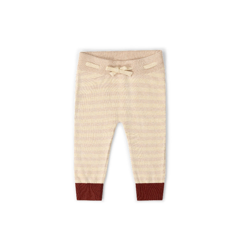 A pair of baby knit pants in a cream and light beige stripe pattern, featuring a matching cream drawstring bow at the elastic waistband and solid dark brown ribbed ankle cuffs.