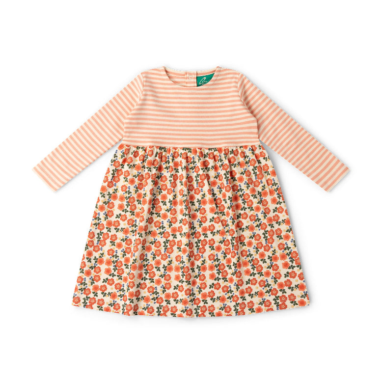 A toddler girl's long-sleeve dress with a peach and white striped bodice and a white skirt featuring an orange and green floral print, laid flat on a white background.