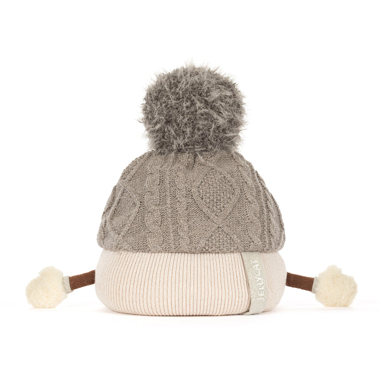 A gray cable-knit beanie hat with a fluffy gray pom-pom on top, a ribbed cream brim, and small cream pom-poms on the sides, photographed on a white background.