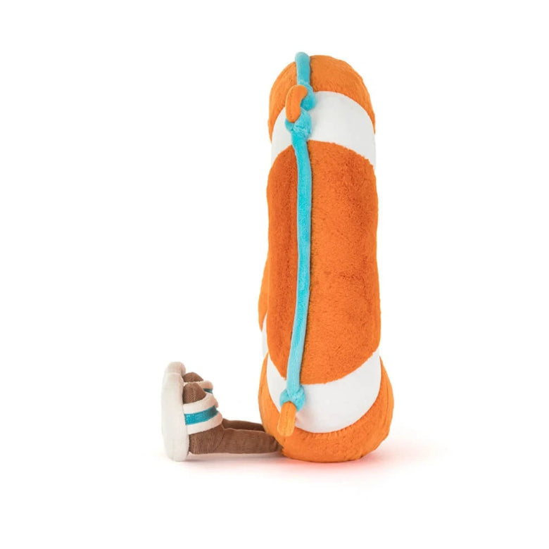 Plush toy resembling a fish with orange body, white belly, and blue accents on a white background