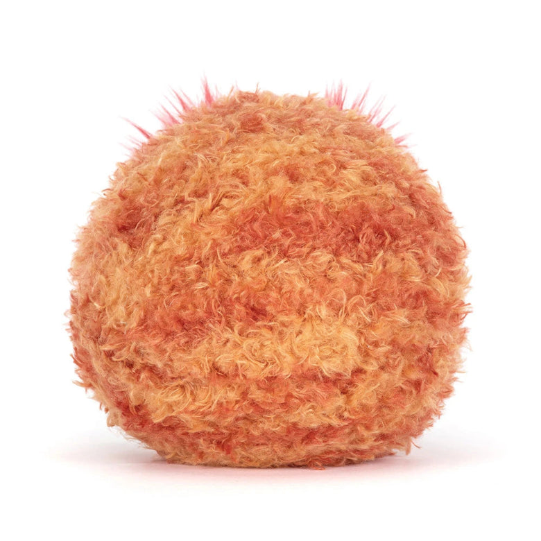 Orange textured ball on a white background