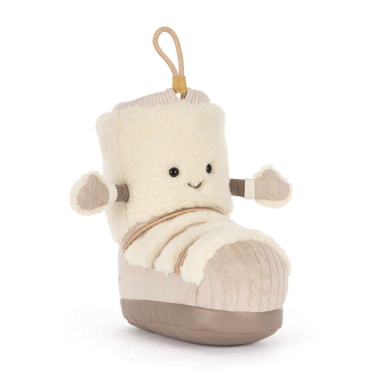 A plush boot-shaped toy or pillow with a cream sherpa upper, beige corduroy-like lower section, and a tan hanging loop at the top, shown on a plain white background.
