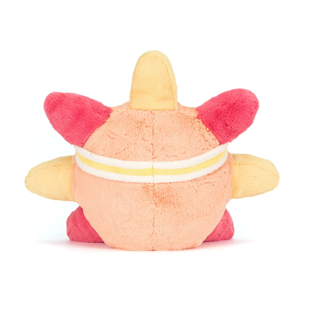 Plush toy resembling a cartoon character with pink accents on a white background