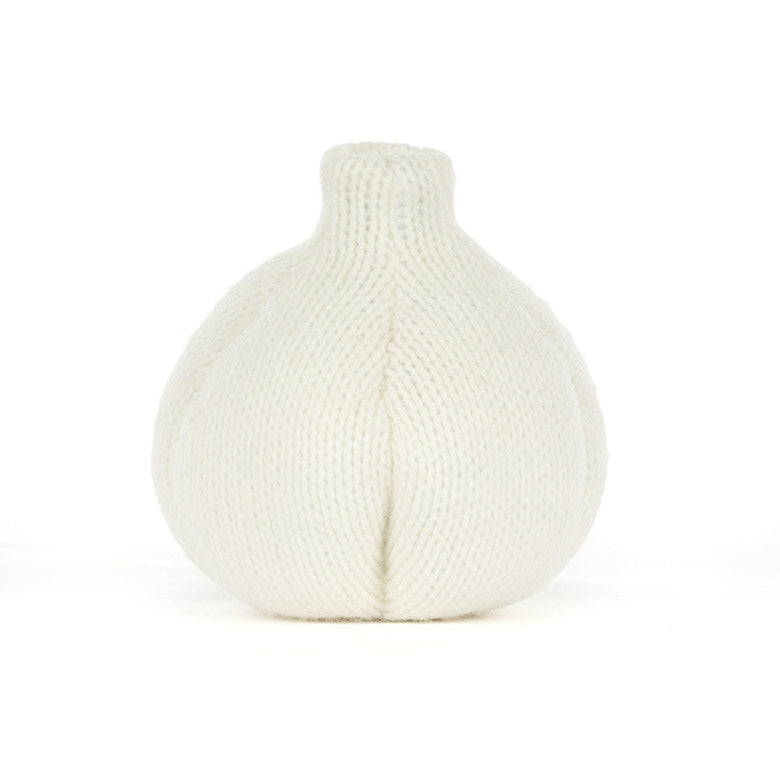 A white knitted garlic-shaped decorative object, photographed against a seamless white background.