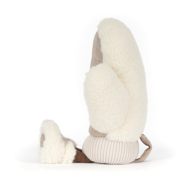 A pair of cream-colored sheepskin winter mittens with light brown lining and ribbed beige cuffs, shown on a clean white background.