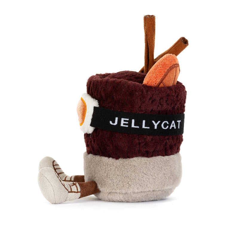 A plush novelty pillow shaped like a coffee cup, featuring a dark burgundy top, a beige bottom, a black band with the white text 'JELLYCAT', and brown cinnamon stick details on a white background.
