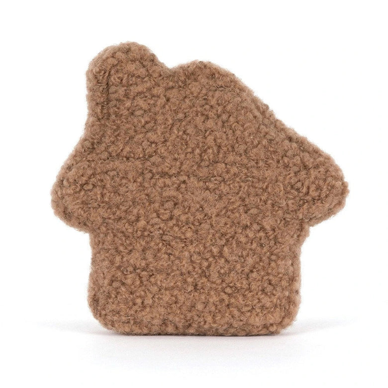A brown textured house-shaped plush toy or cushion on a clean white background.