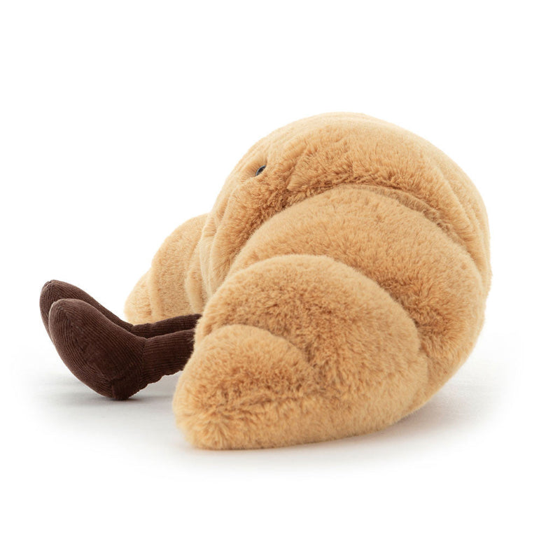 Plush toy resembling a brown animal on a white background