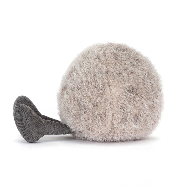 Fluffy gray ball with ribbed texture on a white background