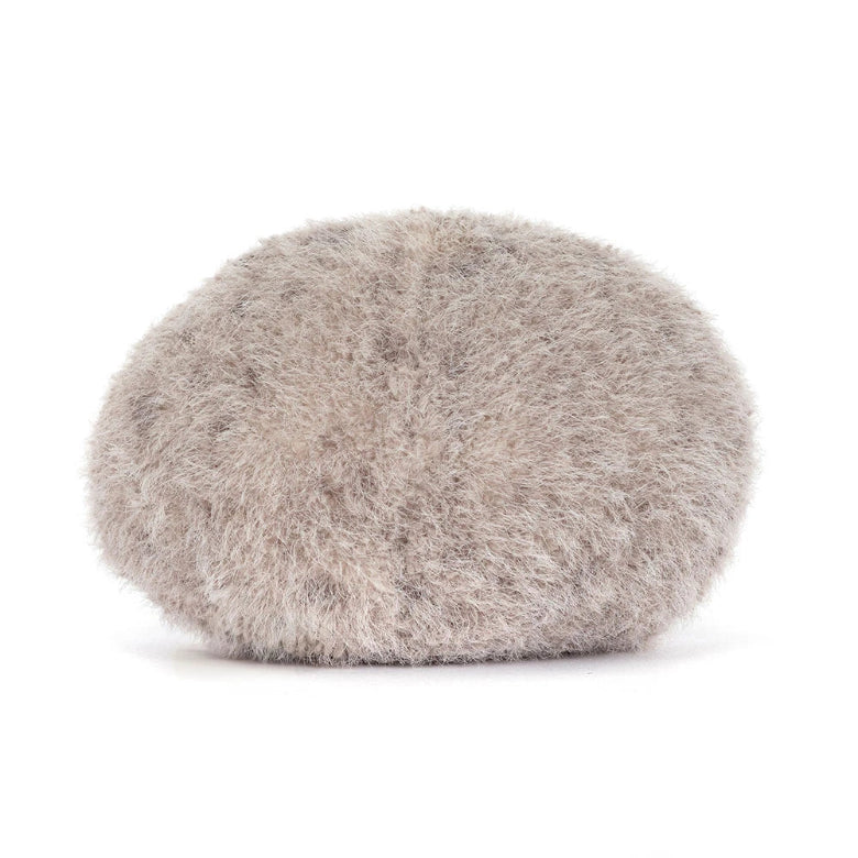 Round, fluffy gray pillow on a white background