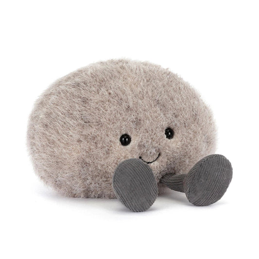 Plush toy resembling a round creature with a smiling face on a white background