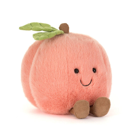 Plush toy peach with a smiling face on a white background