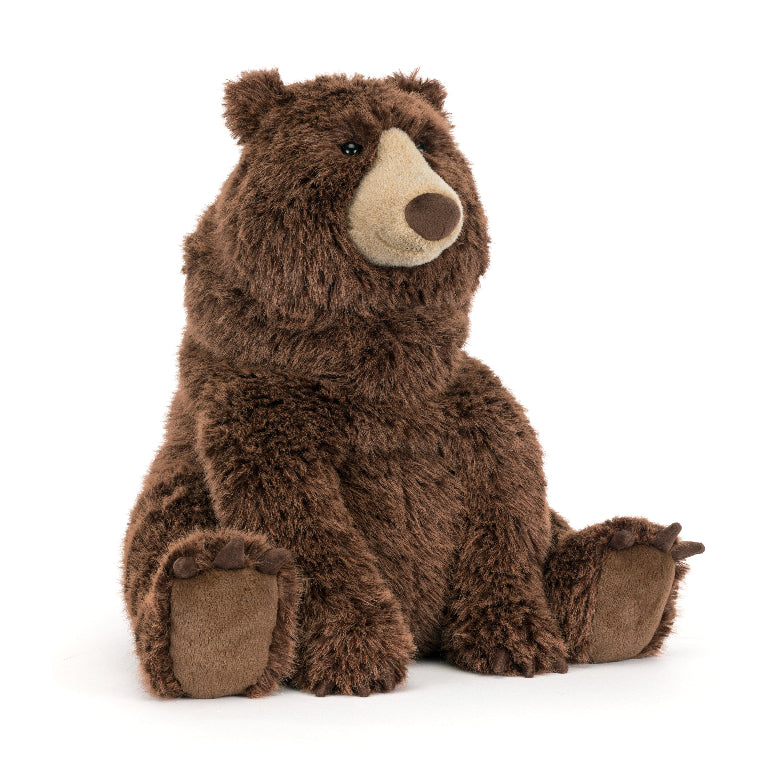 A plush brown bear stuffed animal sitting upright on a clean white background.