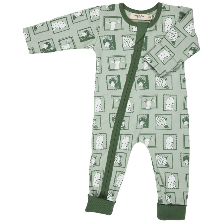 Green baby onesie with pattern on a white background