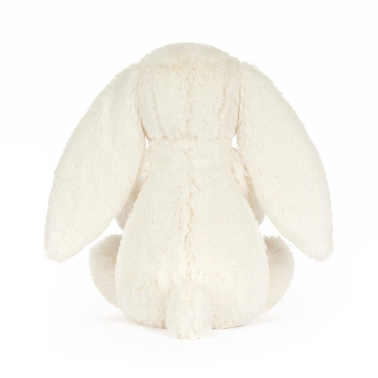 White plush bunny toy on a white background