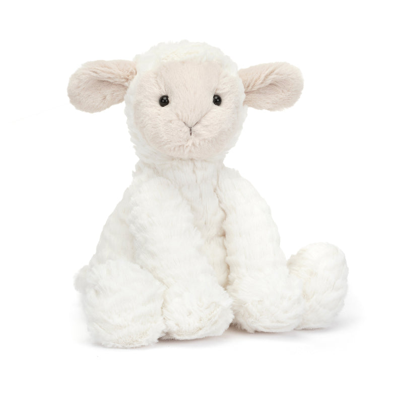 Plush lamb toy on a white background