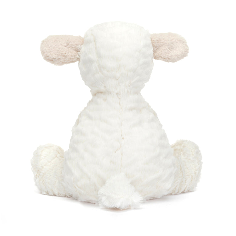 White fluffy toy sheep on a white background