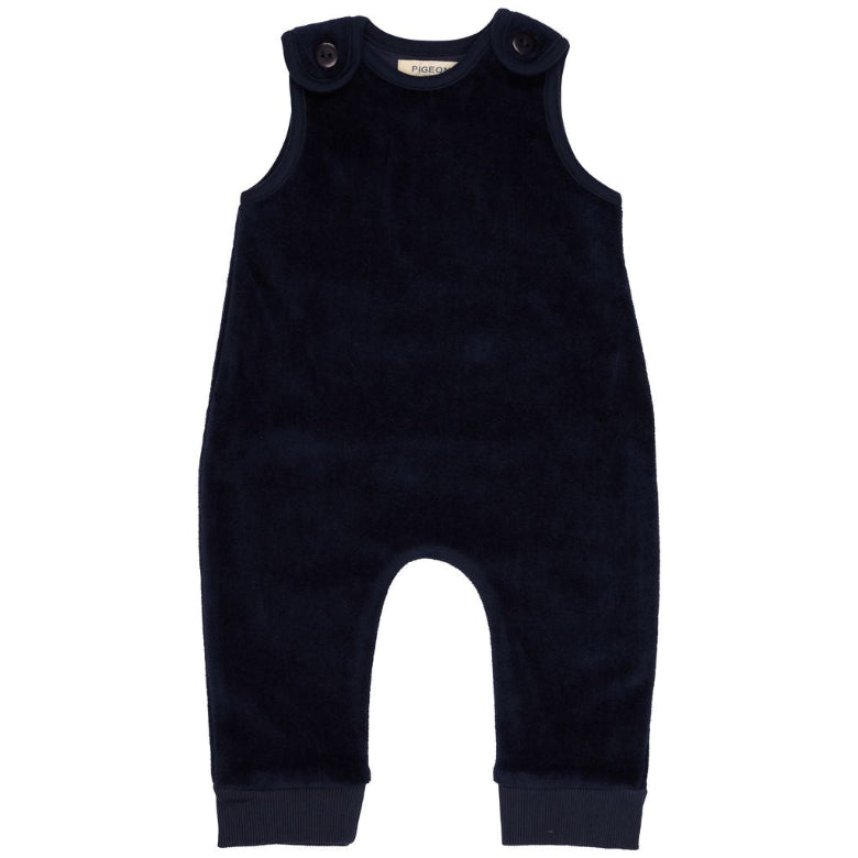 A dark navy blue corduroy baby jumpsuit with shoulder buttons, photographed flat against a solid white background.
