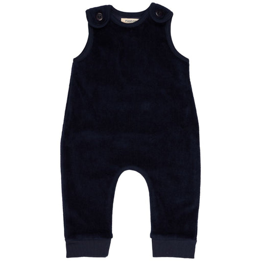 A dark navy blue corduroy baby jumpsuit with shoulder buttons, photographed flat against a solid white background.