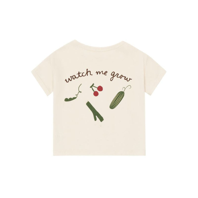 Beige t-shirt with 'watch me grow' text and plant illustrations on a white background
