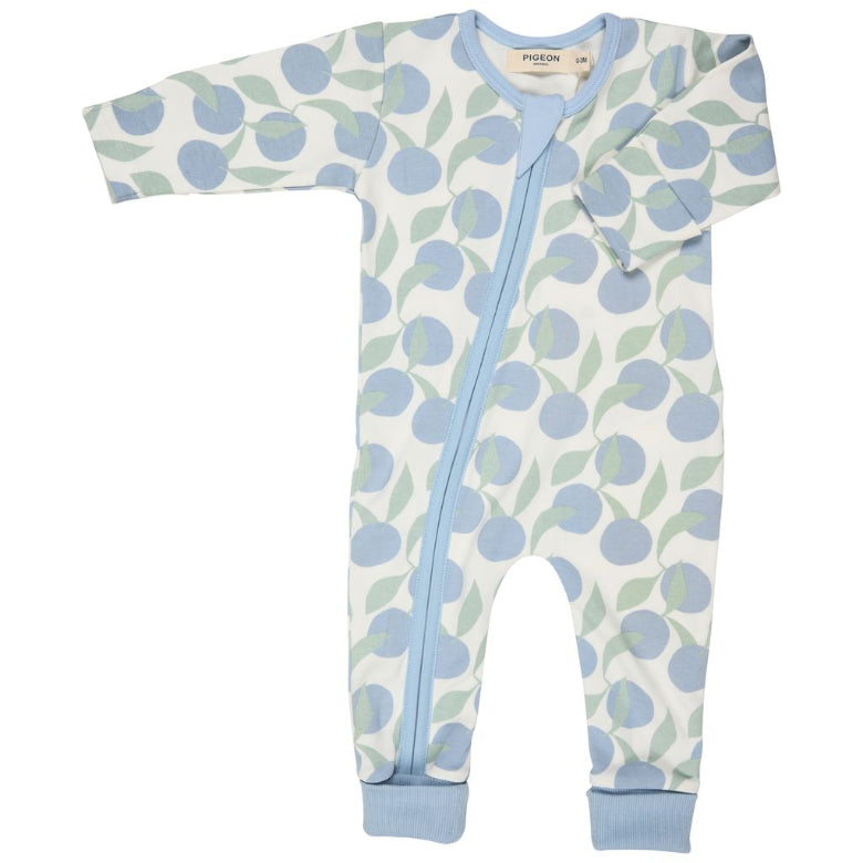 Baby onesie with blue and green fruit pattern on a white background
