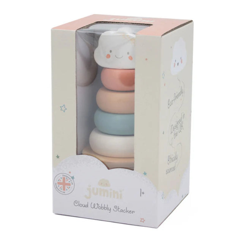 Stack of colorful baby rattle rings in a Gumbi branded box on a white background