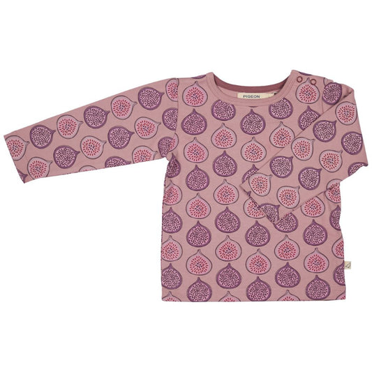 A long-sleeve baby top in dusty pink with an allover pattern of purple and pink figs, shown flat on a white background.