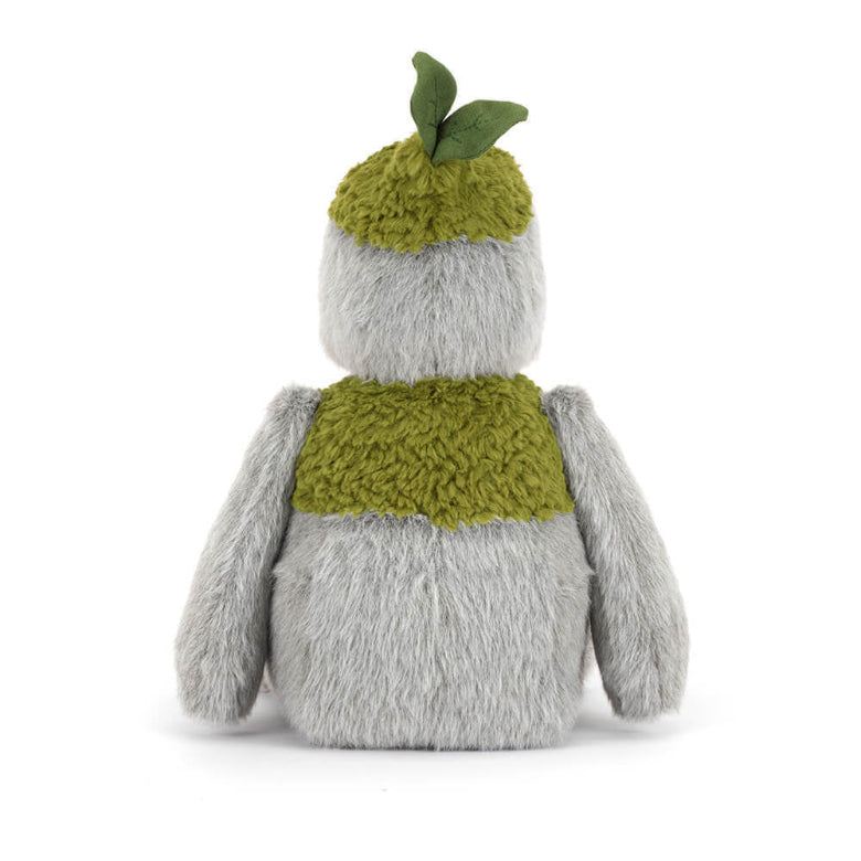 Plush toy resembling a penguin with a green knitted sweater and hat on a white background