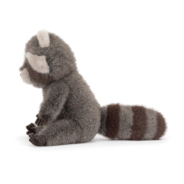 Plush raccoon toy on a white background